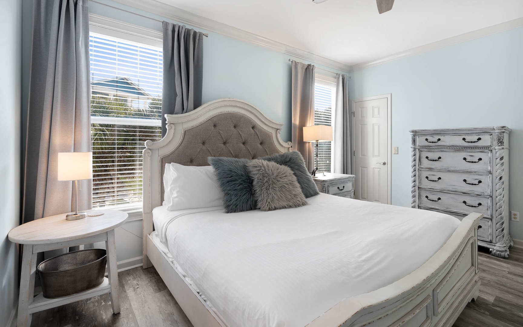 Unwind in your elegant bedroom with plush linens and calming blue tones that promise peaceful nights of rest.