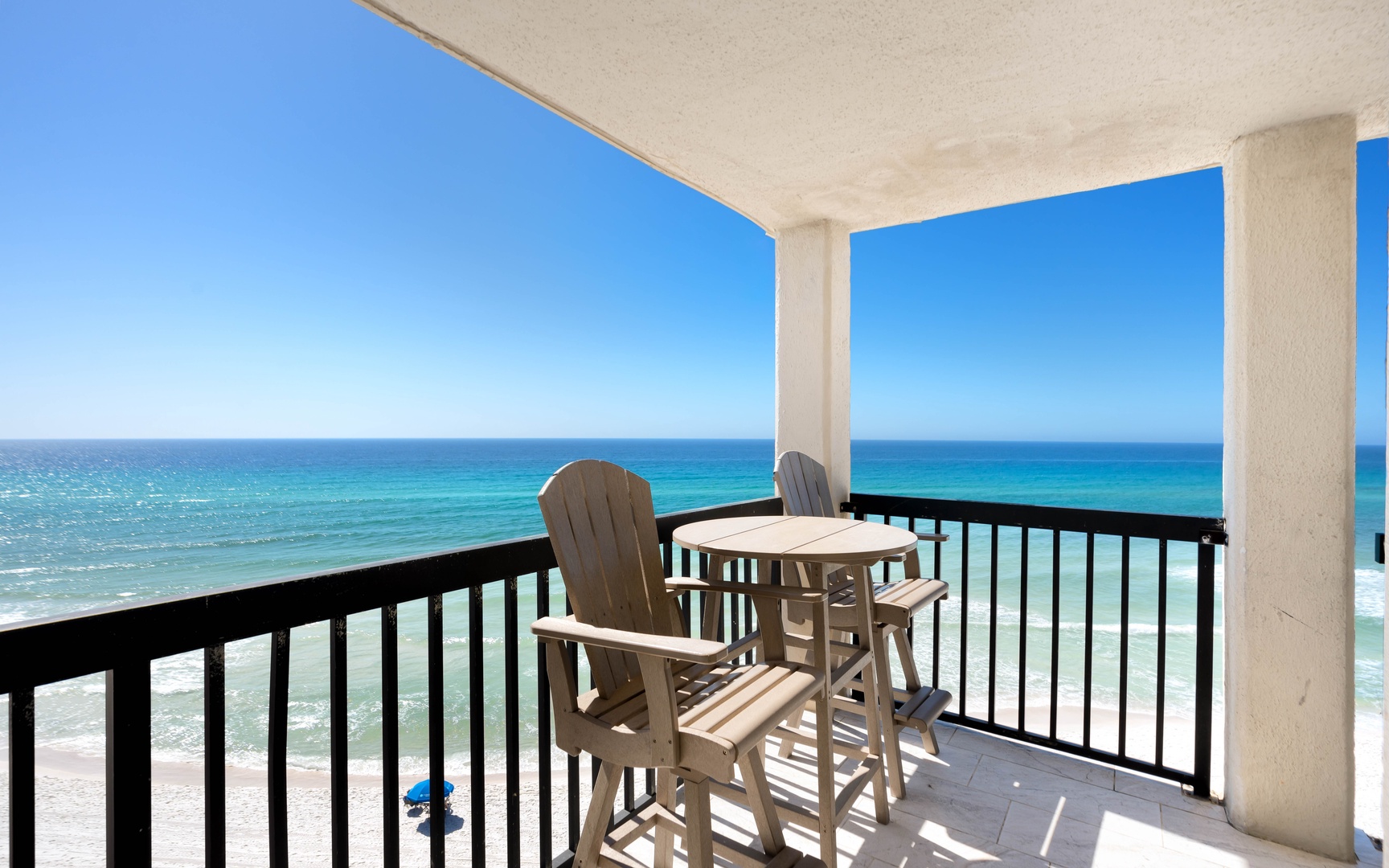 Sip your morning coffee on this private balcony while turquoise waves stretch endlessly before you.