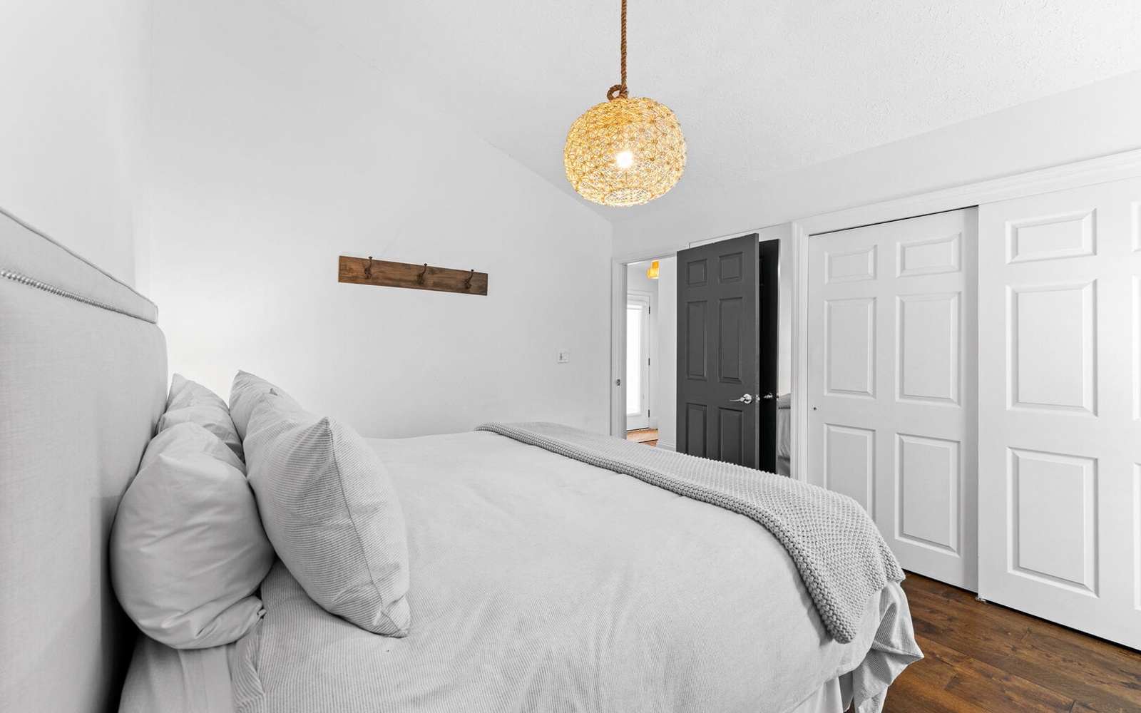 Drift into peaceful sleep in your cozy retreat, wrapped in soft linens beneath the warm glow of ambient lighting.