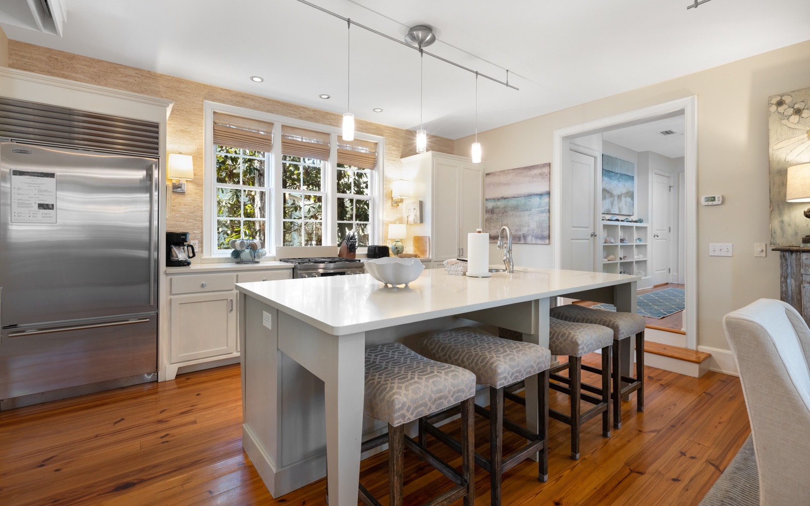 Step into your dream kitchen with gleaming countertops, stainless appliances, and a breakfast bar perfect for morning coffee or evening wine.