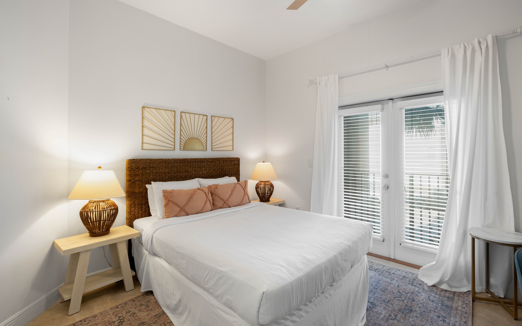 Sink into crisp white linens and wake up refreshed in this serene bedroom. Natural light filters through your private balcony doors.