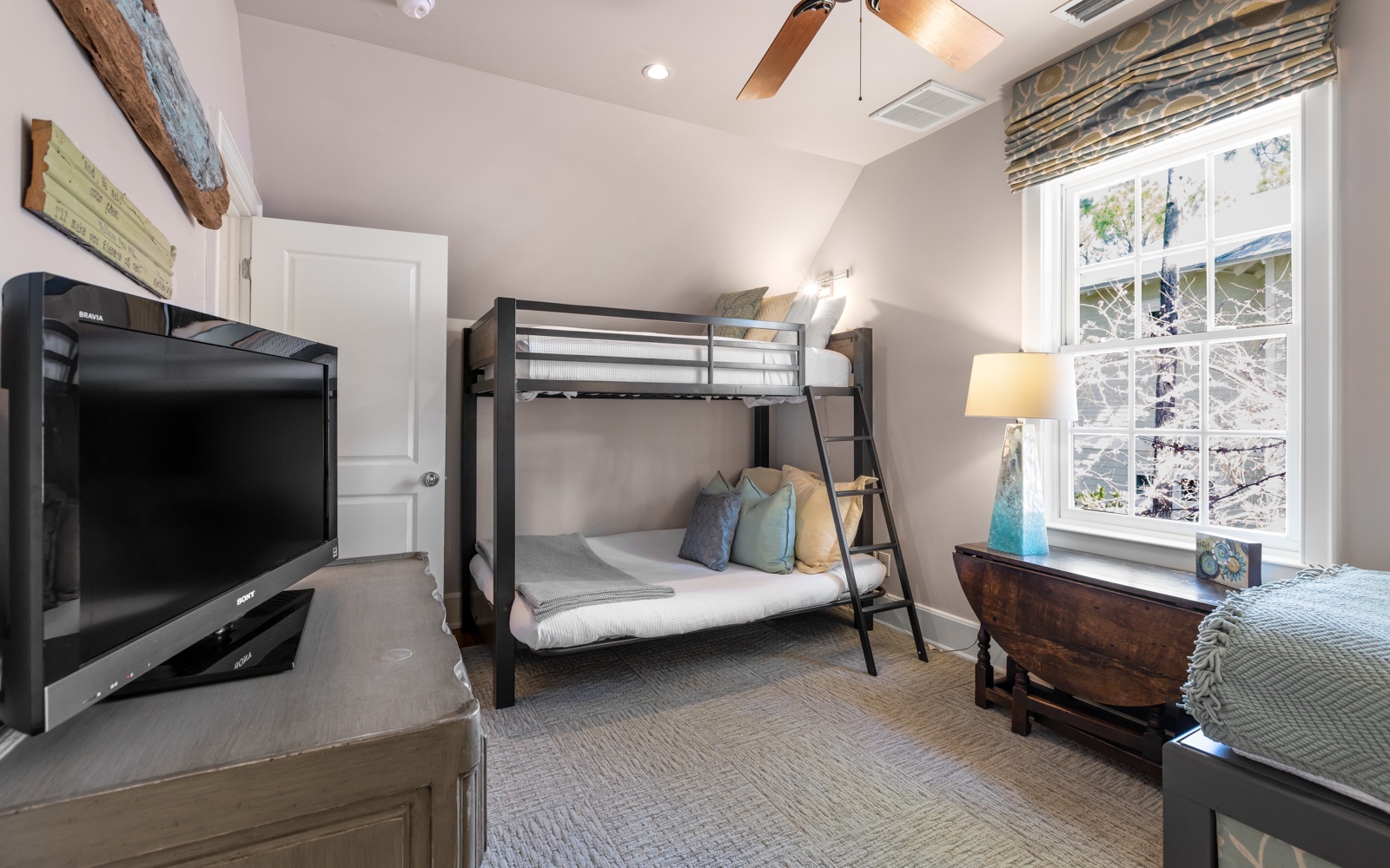 Your cozy retreat features a fun bunk bed for the kids, smart TV entertainment, and charming details.