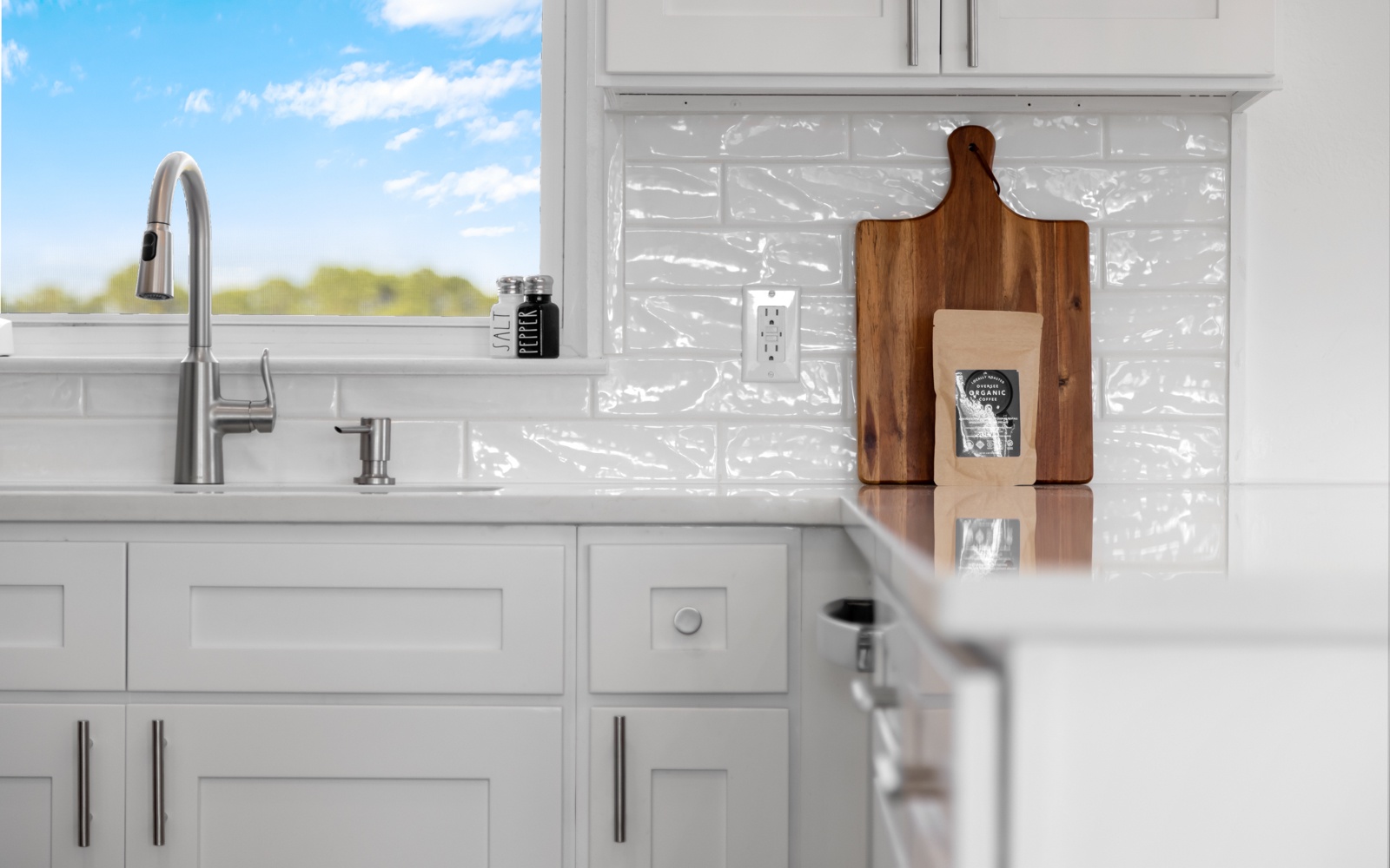 Your bright, fully-equipped kitchen features modern appliances and sleek countertops, perfect for preparing meals during your stay.