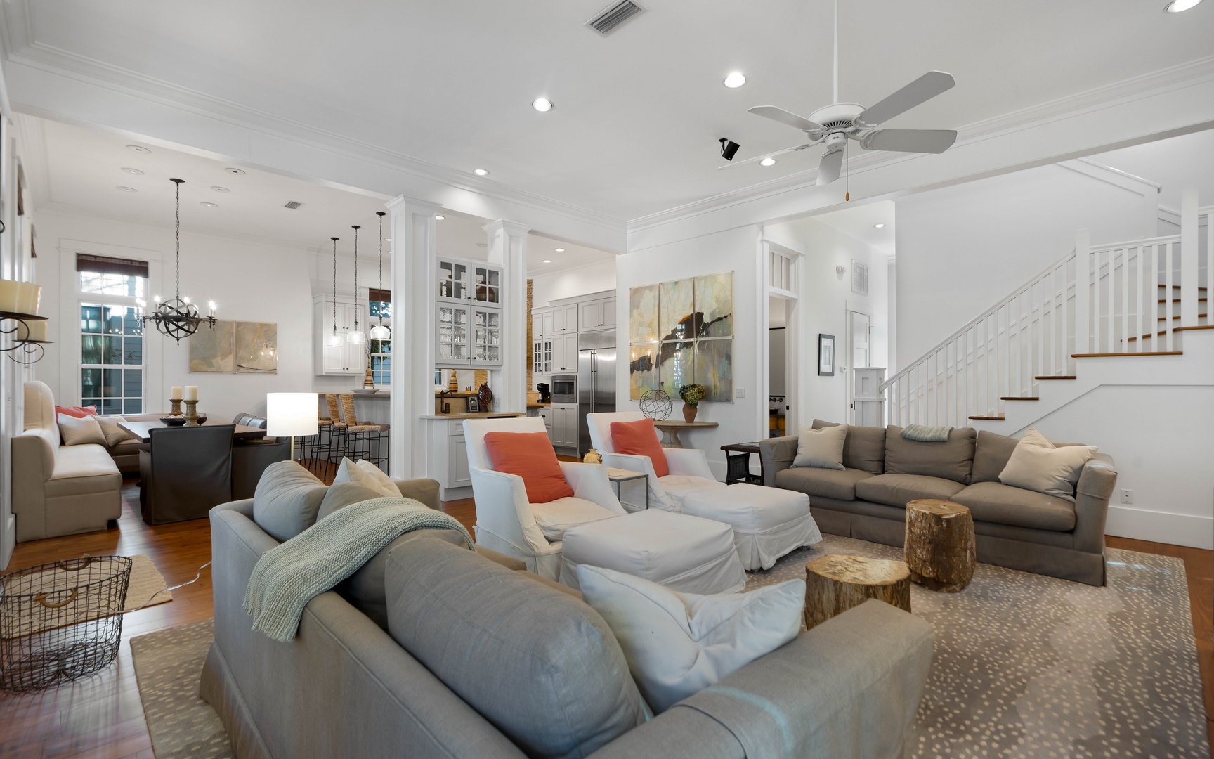 Sink into plush sofas in your spacious living room, where natural light streams through windows and cozy seating invites relaxation.