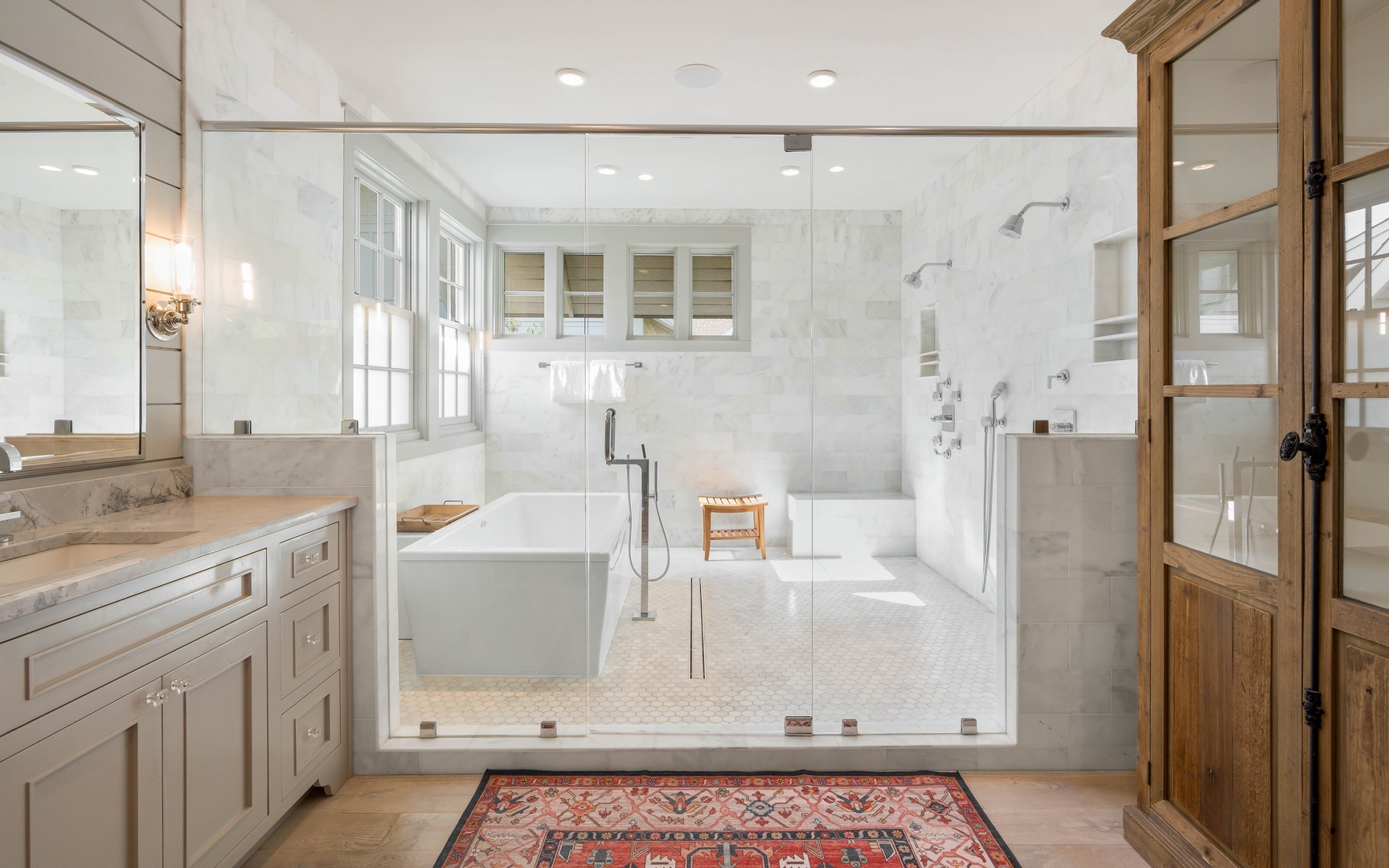 Luxurious spa-inspired bathroom with marble shower, soaking tub, and elegant finishes for your perfect retreat.