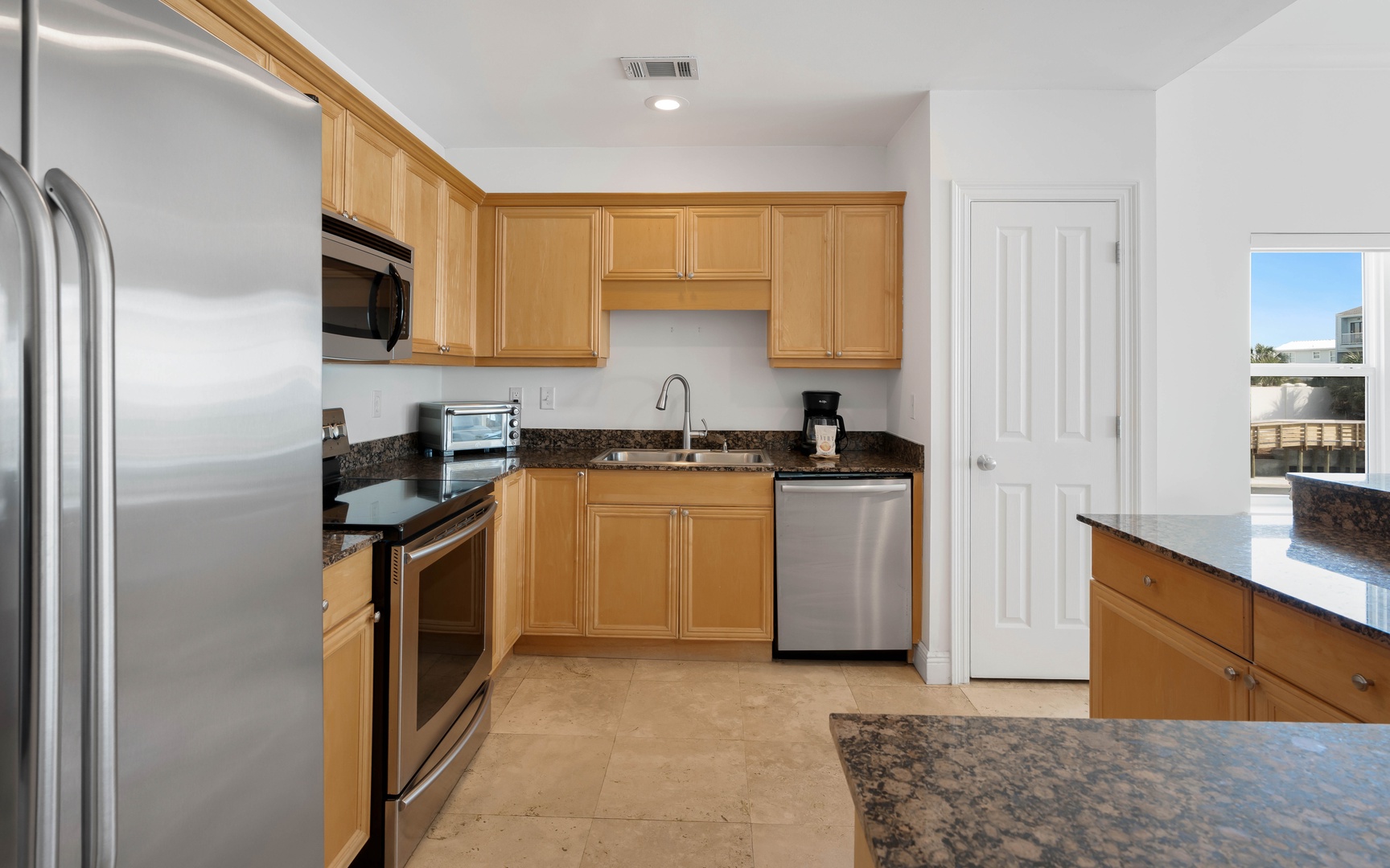 Your fully equipped kitchen features stainless steel appliances and granite countertops, perfect for preparing meals during your stay.