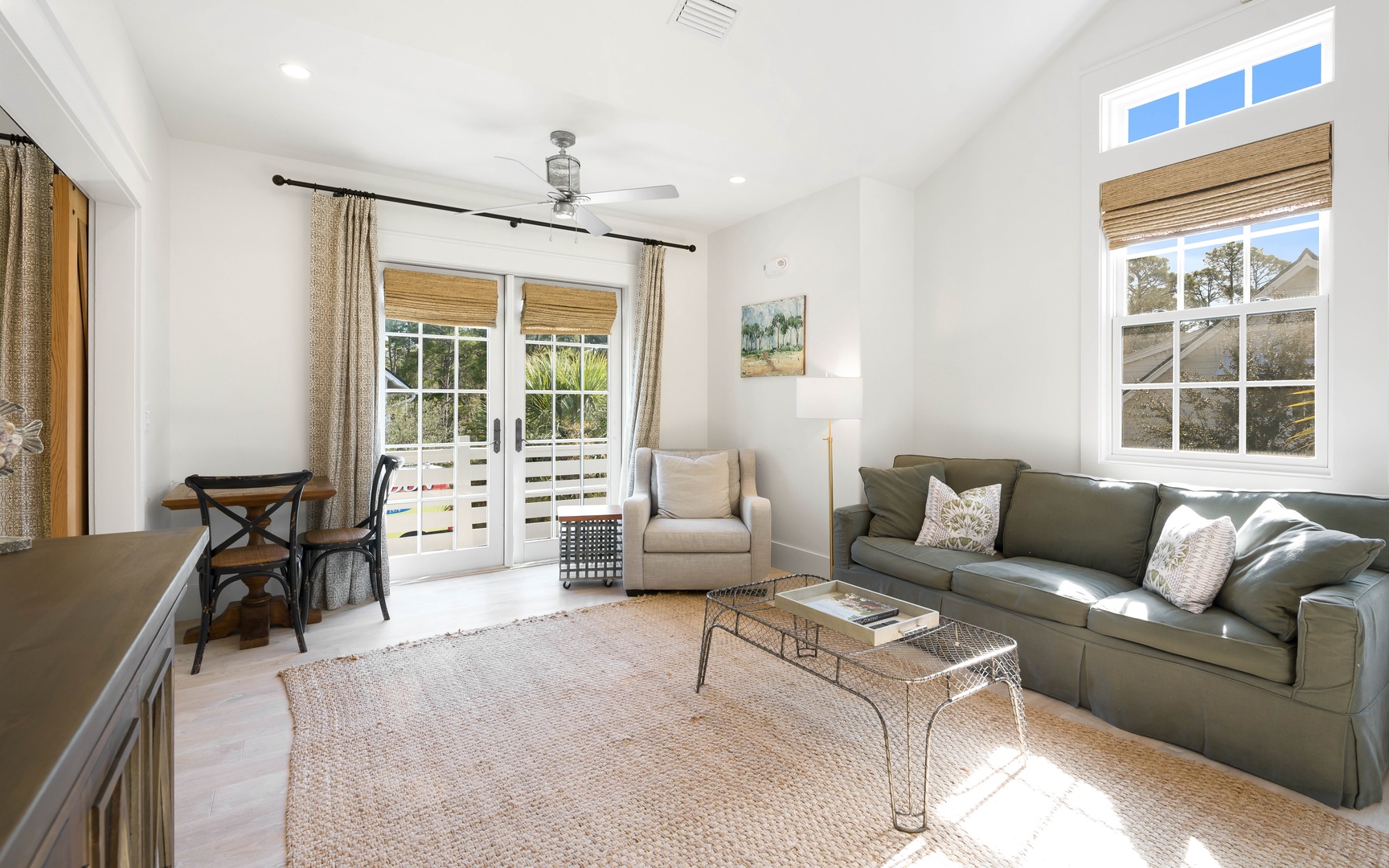 Relax in your bright, airy living space where natural light streams through French doors leading to your private balcony.