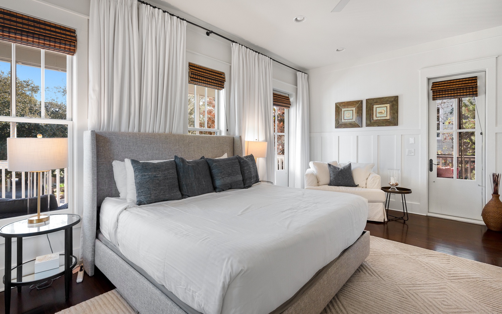Rest peacefully in your serene bedroom featuring crisp white linens, natural light, and a cozy reading nook by the window.