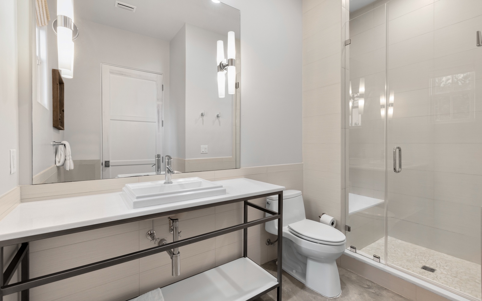 Step into your spa-like bathroom featuring a luxurious glass shower, sleek vanity, and modern fixtures designed for your ultimate comfort.