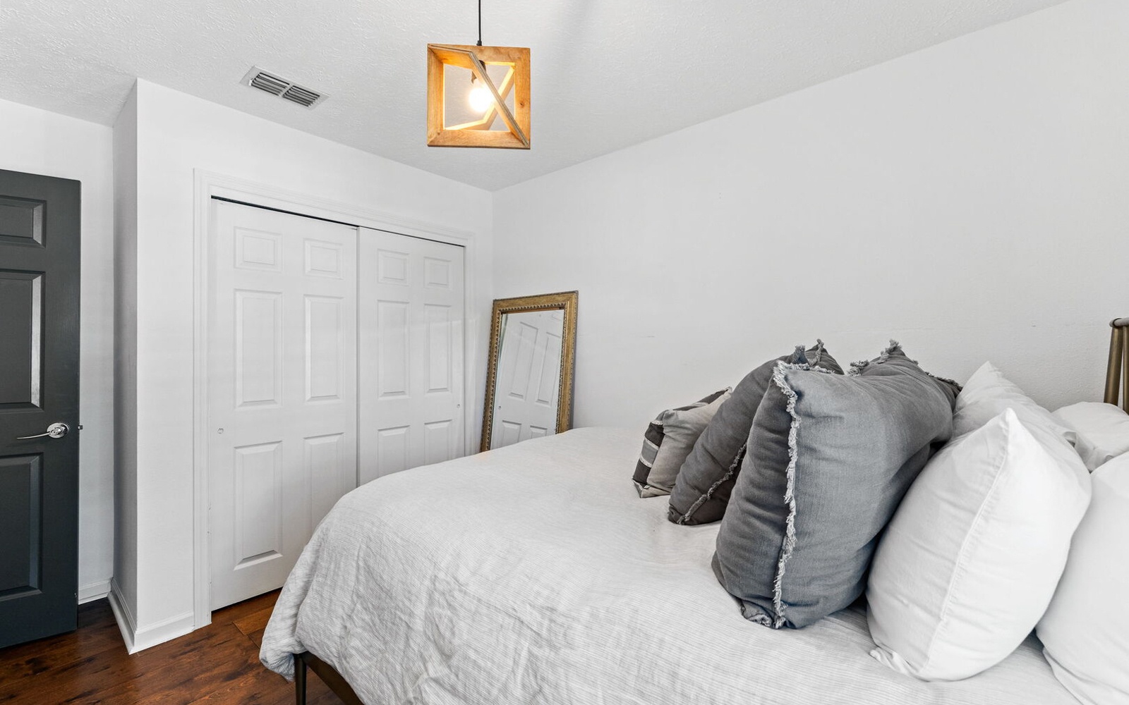 Sink into crisp white linens and plush pillows in your serene bedroom retreat, complete with thoughtful touches and ample storage.