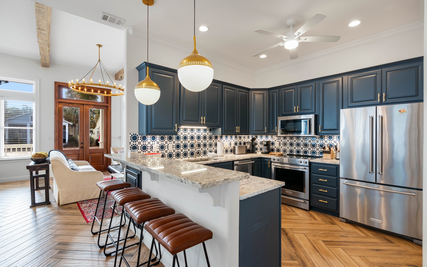 Your gourmet kitchen features navy cabinets, granite counters, and a breakfast bar where you'll savor morning coffee.