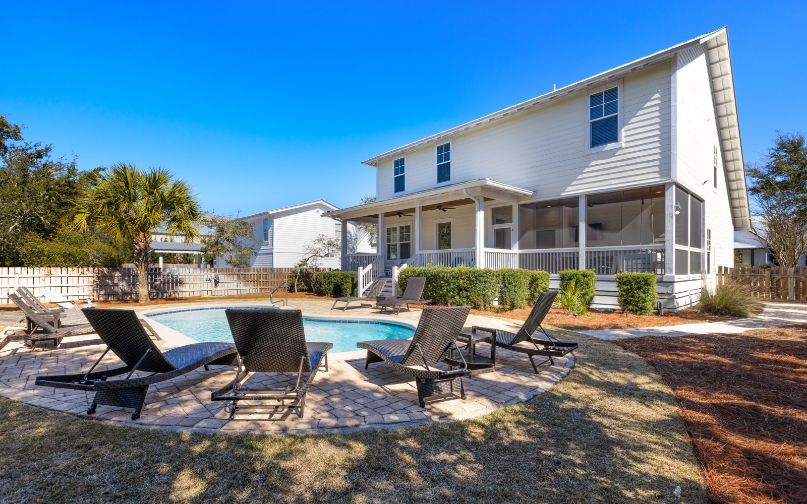 Stunning white coastal home with private pool and comfortable loungers awaits your perfect beach getaway retreat.