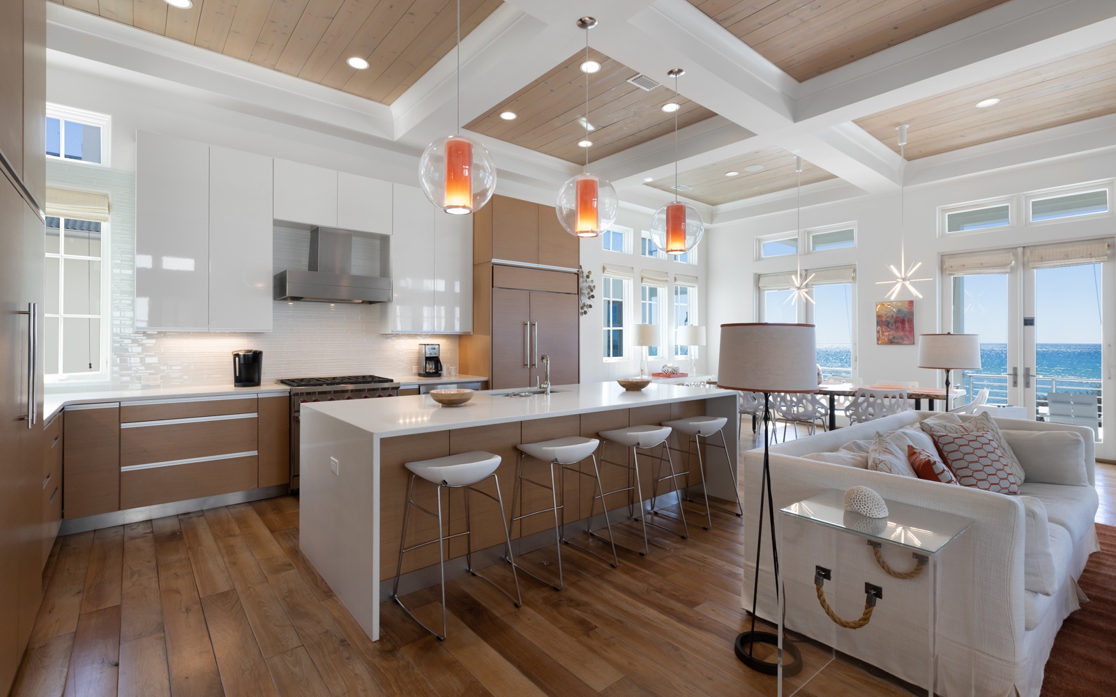 Unwind in this stunning open-concept space where modern elegance meets comfort. Your gourmet kitchen flows into cozy seating with breathtaking gulf views.
