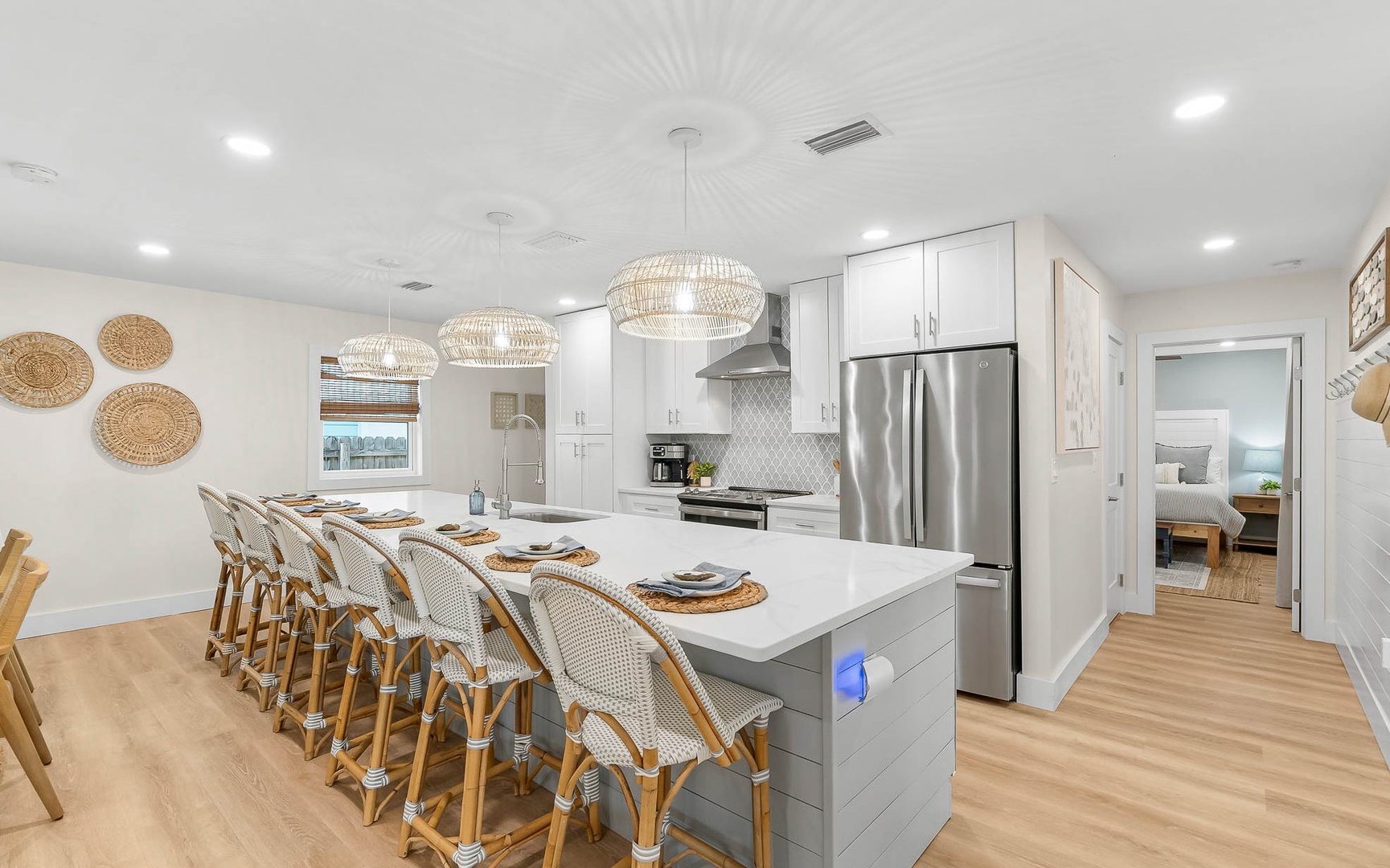 Your chef-style kitchen features elegant pendant lighting and spacious island seating for memorable group meals together.