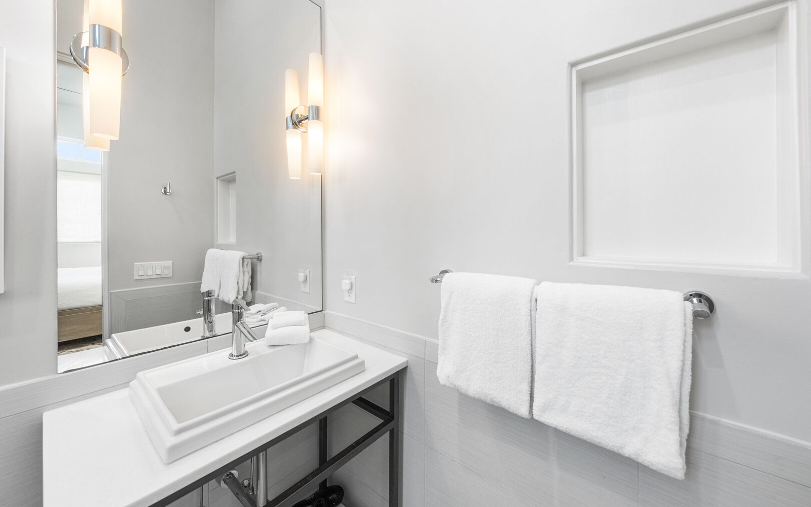 Step into your pristine bathroom featuring elegant fixtures, soft lighting, and plush towels ready for your refreshing morning routine.