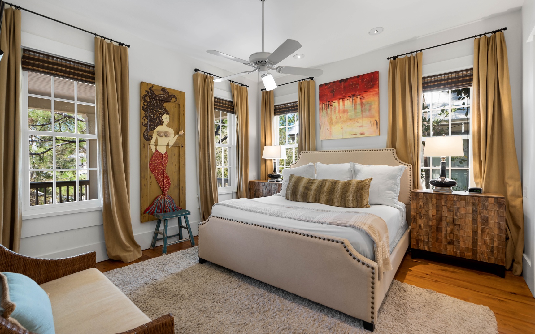Sink into your elegant bedroom sanctuary with plush linens, warm lighting, and charming artwork creating the perfect retreat after exploring.