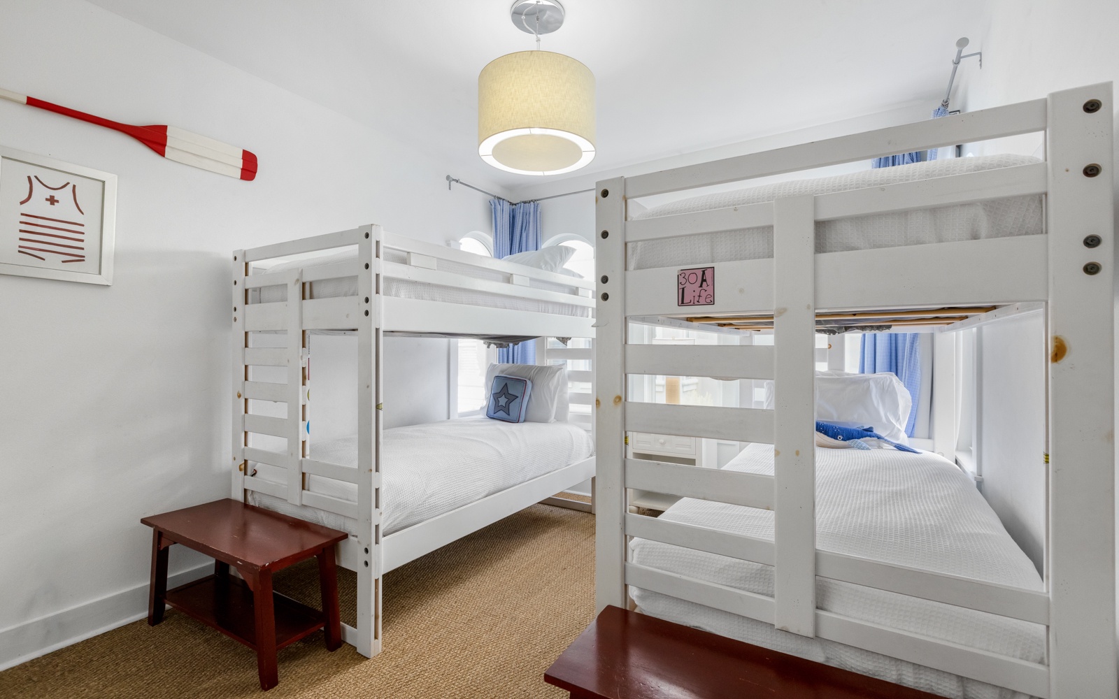 Cozy bunk room with fresh linens and nautical touches - perfect for kids or groups sharing adventures together.
