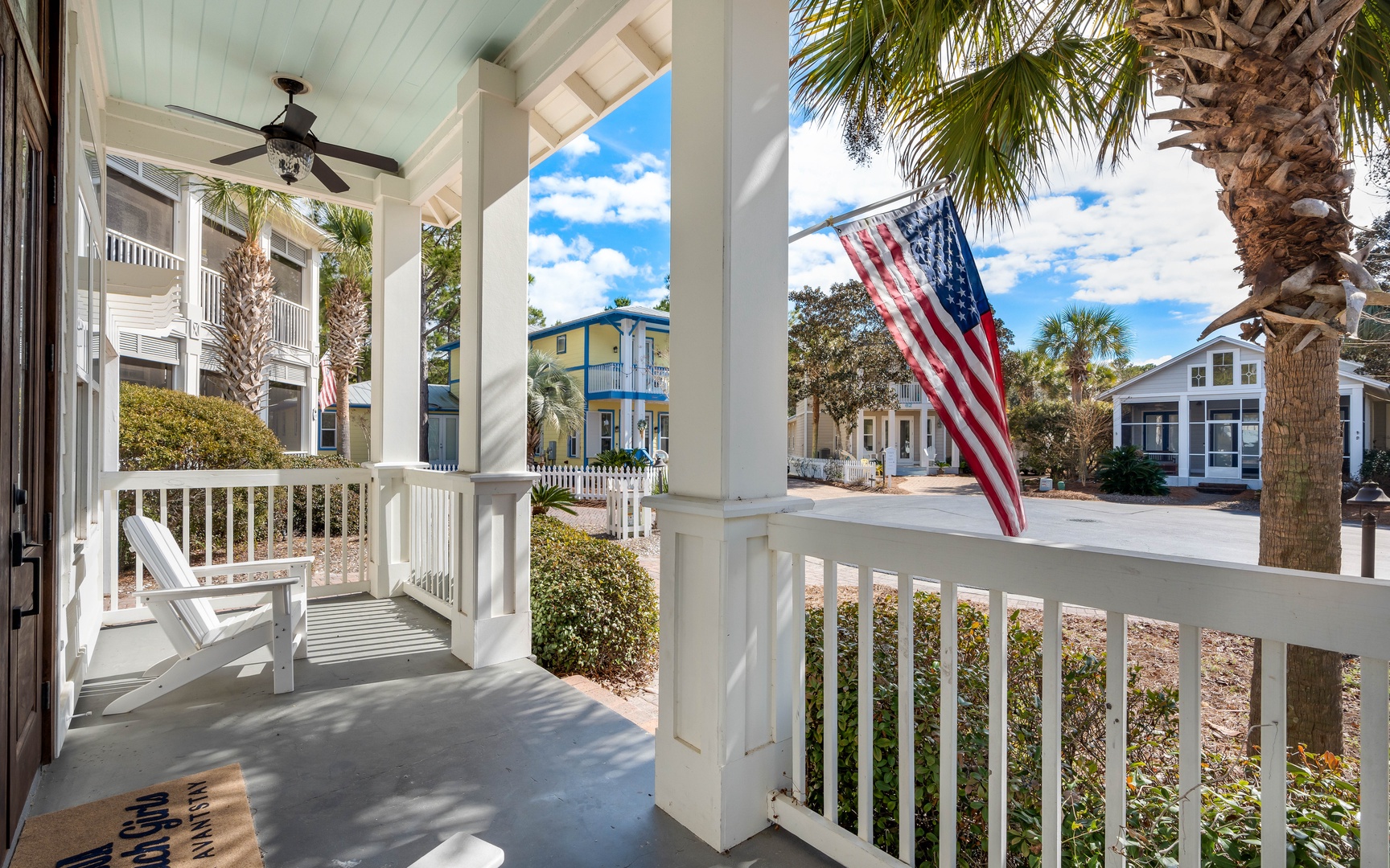 Step onto your charming front porch and feel the coastal breeze as you relax in comfortable chairs under the covered veranda.