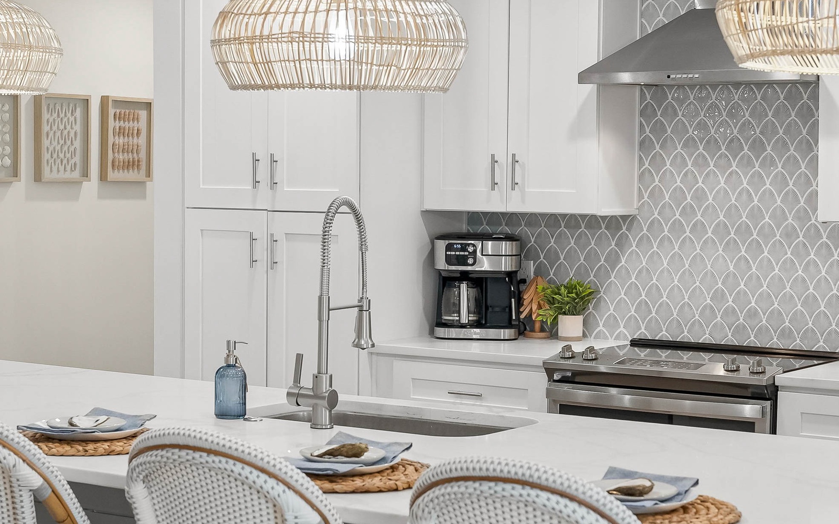 Your bright kitchen features modern appliances and elegant pendant lighting, perfect for preparing meals together.
