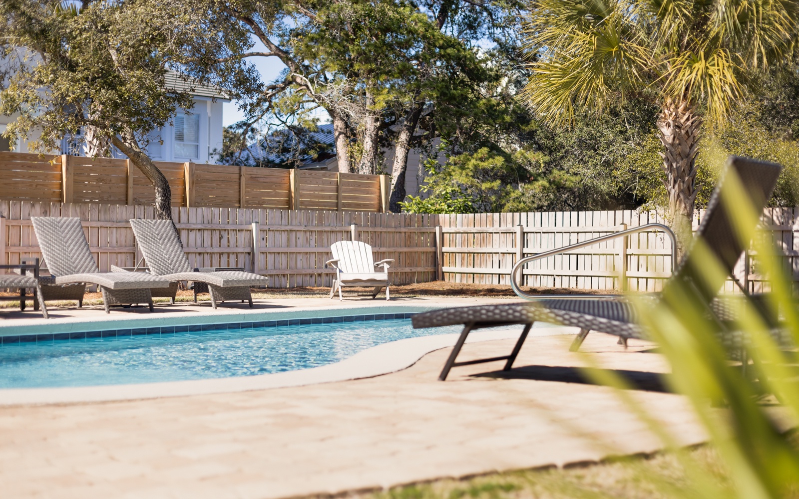 Your private poolside oasis awaits with comfortable loungers and tropical landscaping for the perfect relaxation retreat.