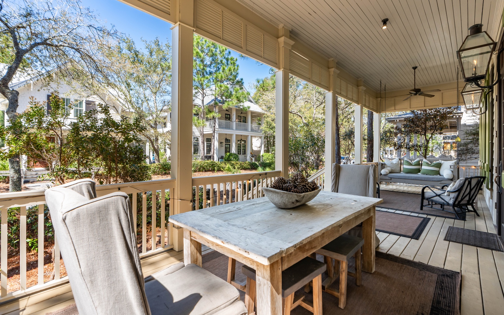 Your covered porch offers peaceful outdoor dining with neighborhood views, perfect for morning coffee or evening meals.