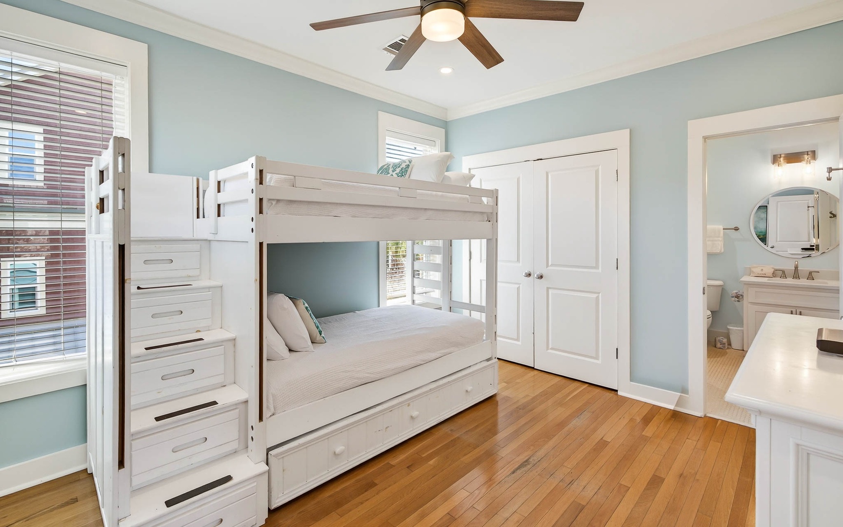 Your bunk bed bedroom offers cozy sleeping for kids with built-in storage stairs and your own private bathroom.