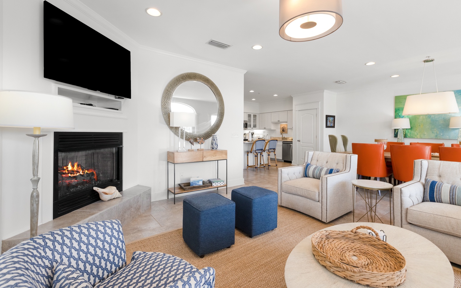 Unwind in your bright, modern living space with cozy fireplace, stylish furnishings, and open kitchen—perfect for relaxing evenings.