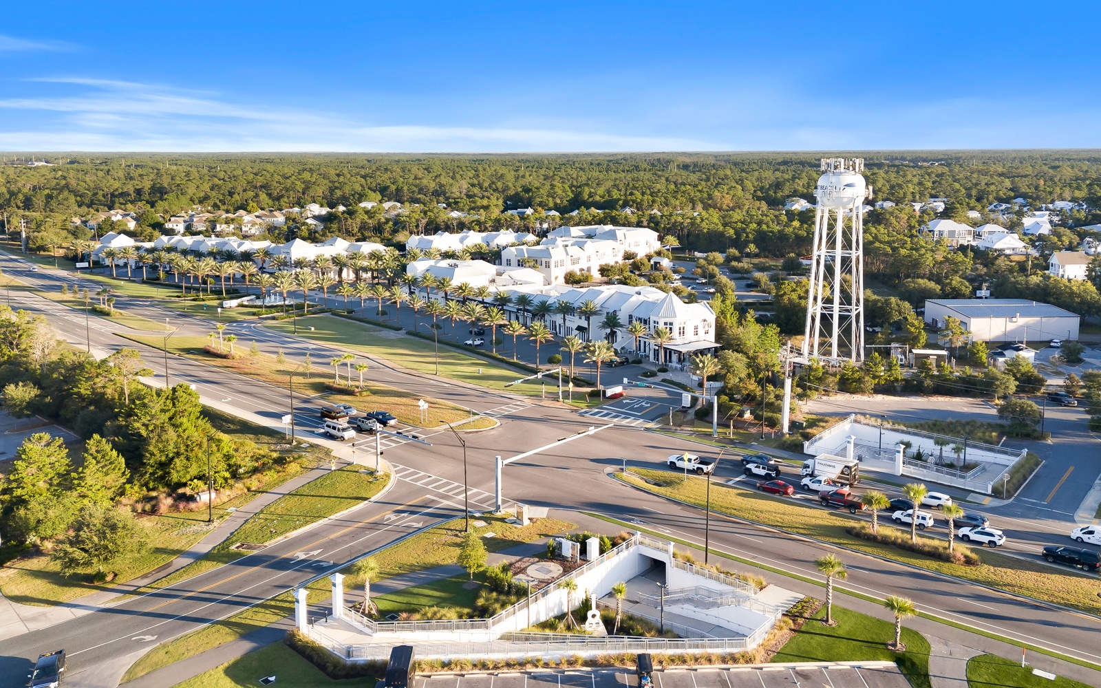 Aerial view of the charming community featuring tree-lined streets, local landmarks including the historic water tower, and peaceful residential neighborhoods.