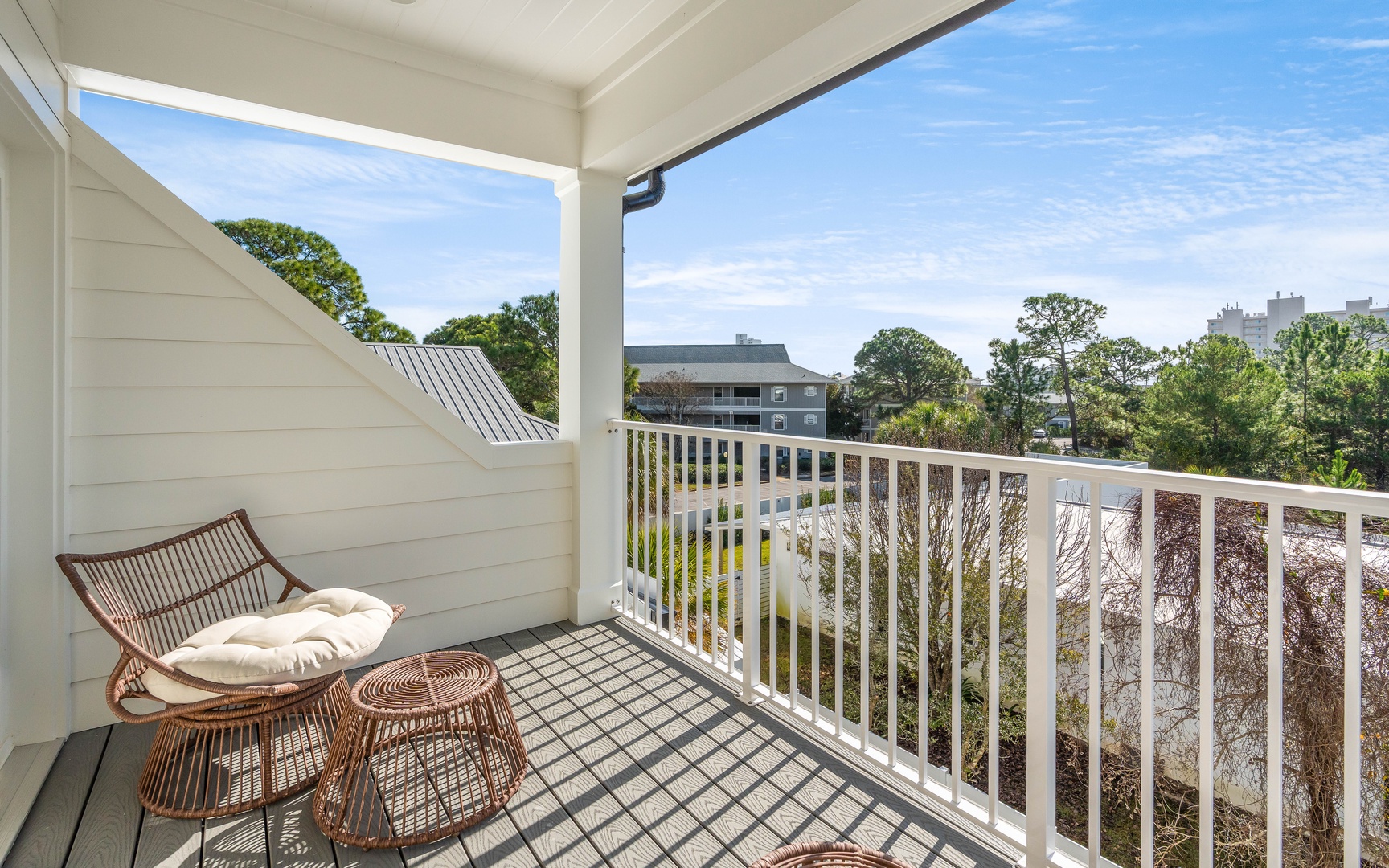 Your private balcony offers peaceful moments with wicker seating overlooking neighborhood views. Relax with morning coffee while enjoying fresh air.