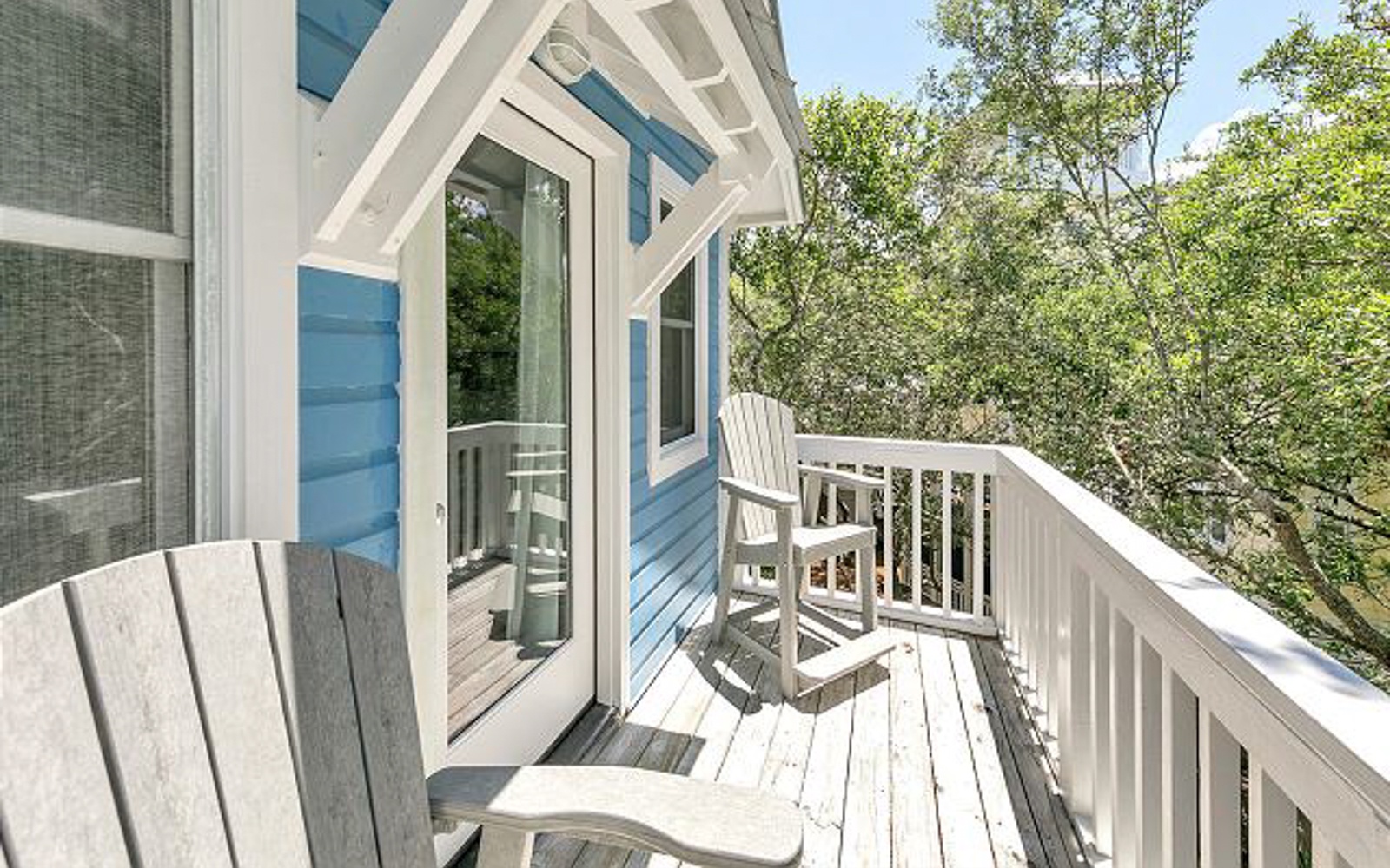 Step onto your private balcony and sink into comfortable Adirondack chairs, where morning coffee tastes better surrounded by lush greenery.