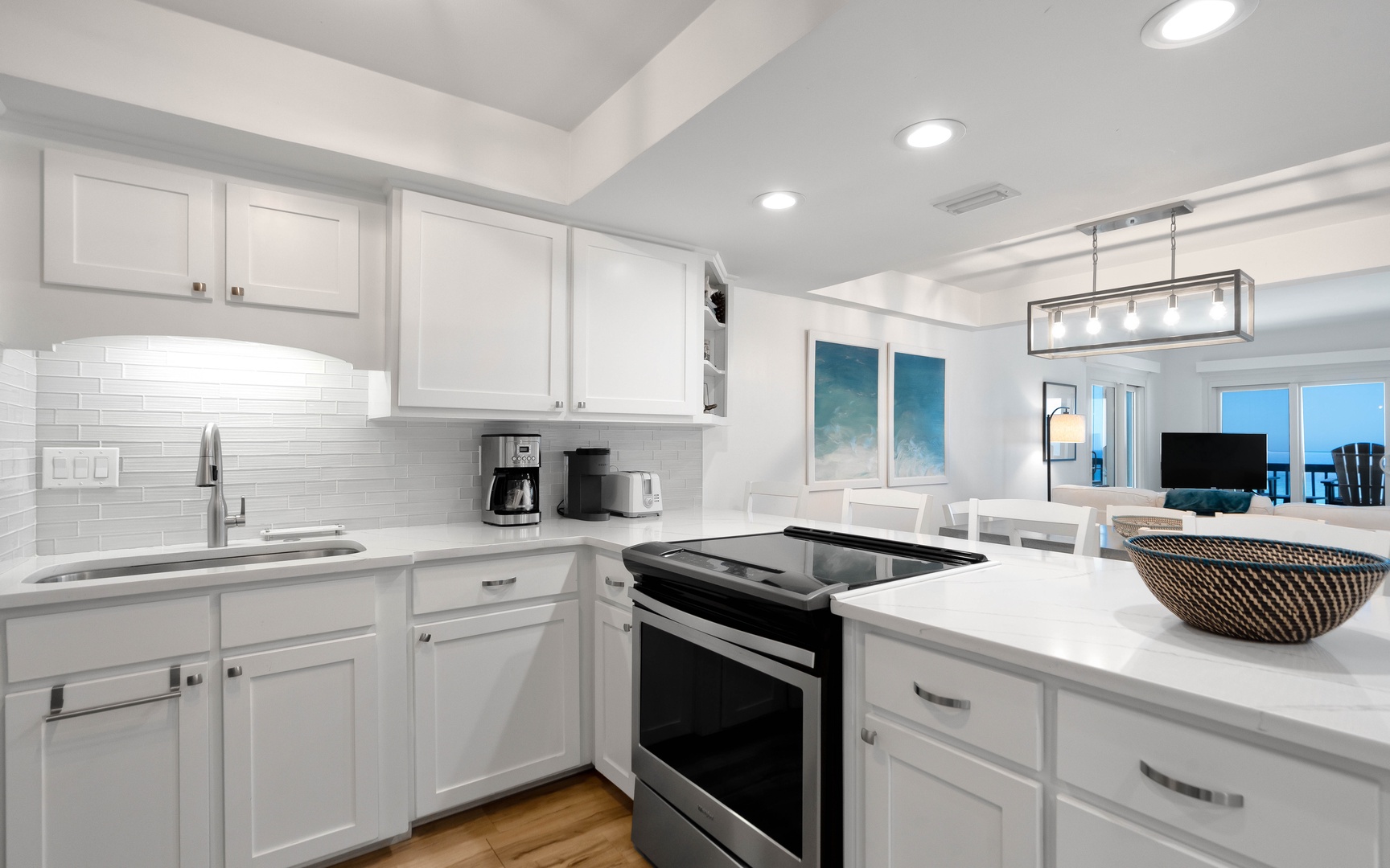 Your pristine white kitchen awaits with modern appliances, gleaming countertops, and everything you need to create memorable meals together.
