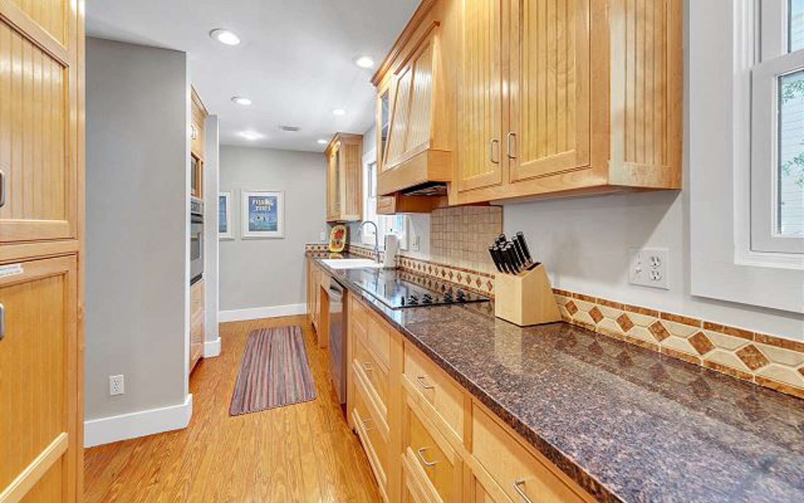 Your fully equipped kitchen features granite countertops, warm wood cabinetry, and quality appliances to make meal prep a joy.