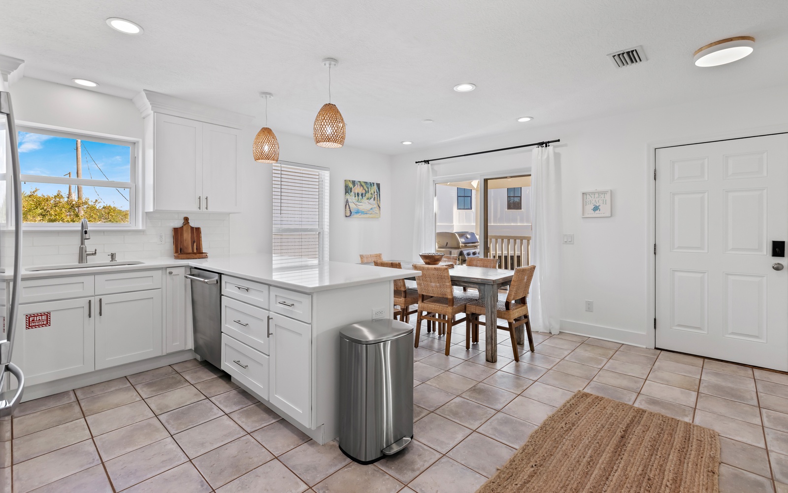 Your bright, fully-equipped kitchen flows seamlessly into the dining area, perfect for preparing meals and gathering together.