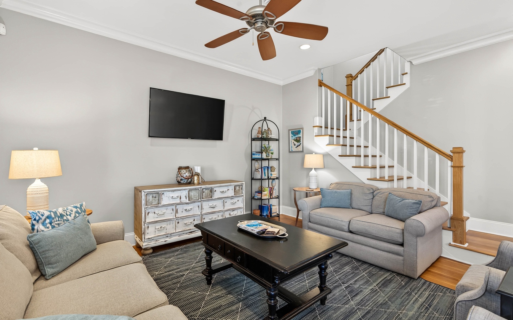 Sink into plush seating while enjoying your favorite shows on the wall-mounted TV in this inviting living space.