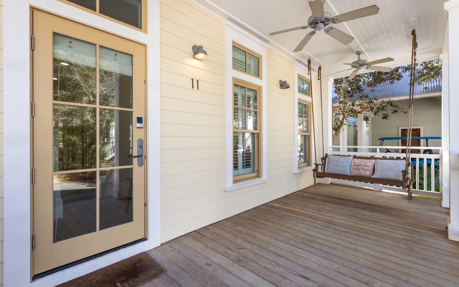 Step onto your private covered porch with ceiling fans and a charming swing where you can unwind with morning coffee or evening relaxation.