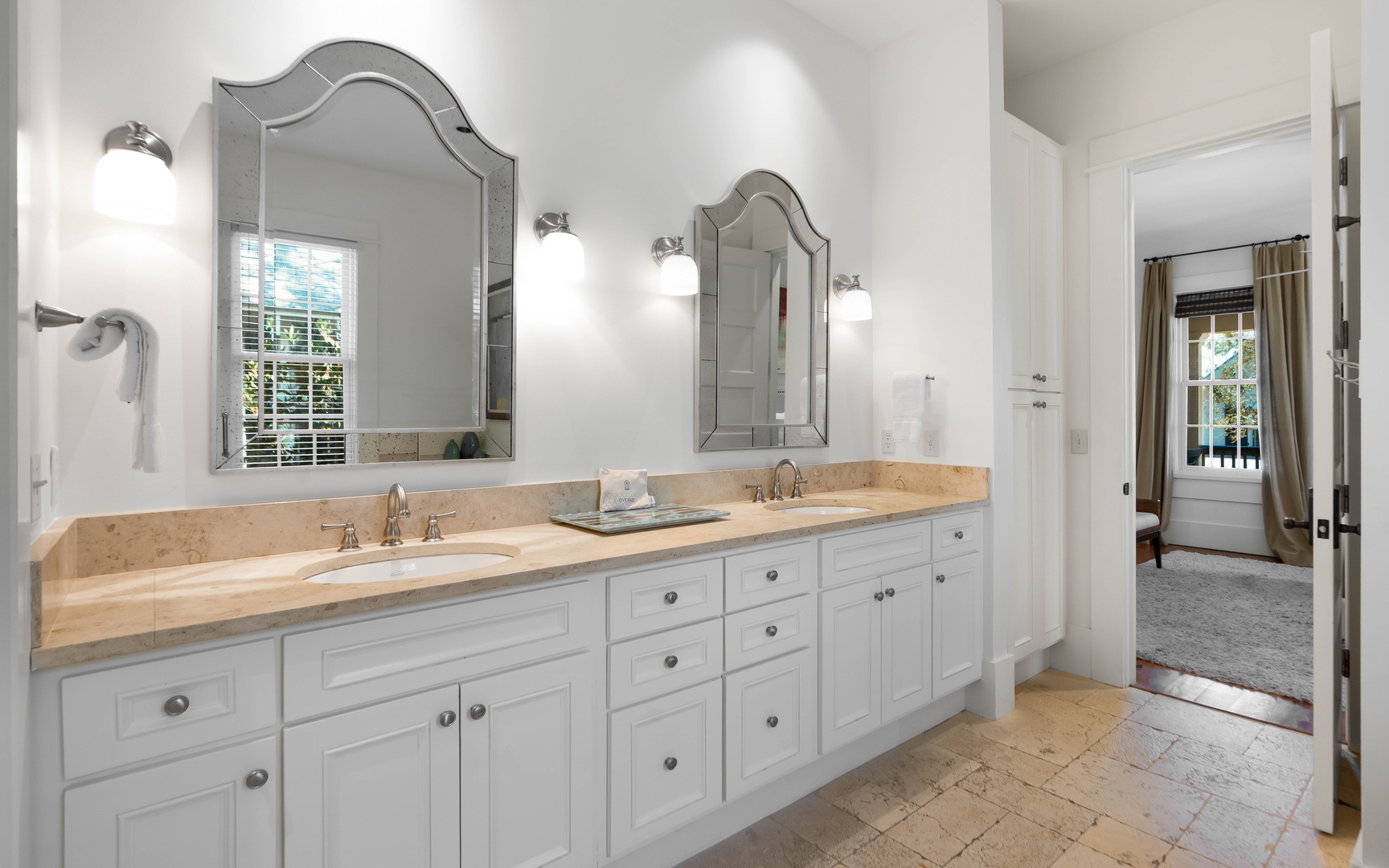 Luxurious master bathroom with dual vanities and elegant mirrors creates your perfect morning routine space.