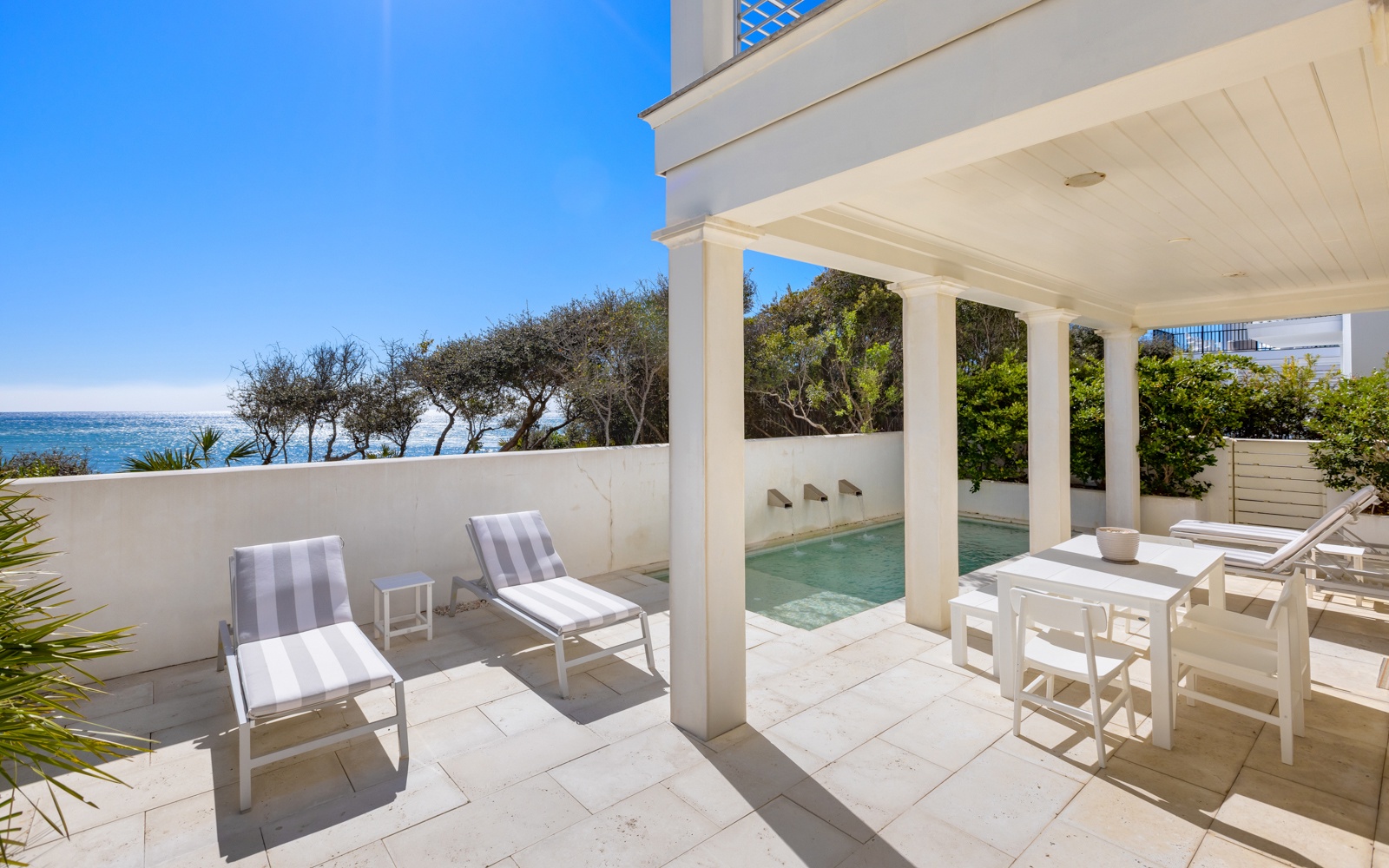 Step onto your private terrace where gulf views and a sparkling pool create your perfect retreat.