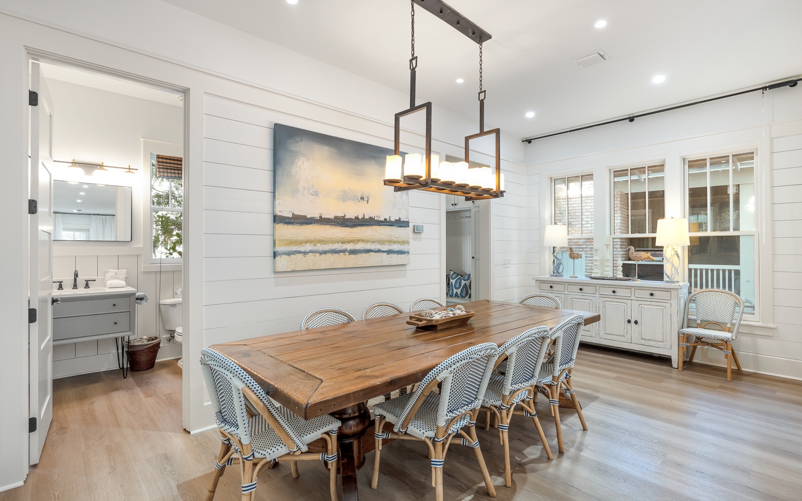 Gather around this beautiful farmhouse dining table where memorable meals and conversations await in your elegant coastal-inspired space.