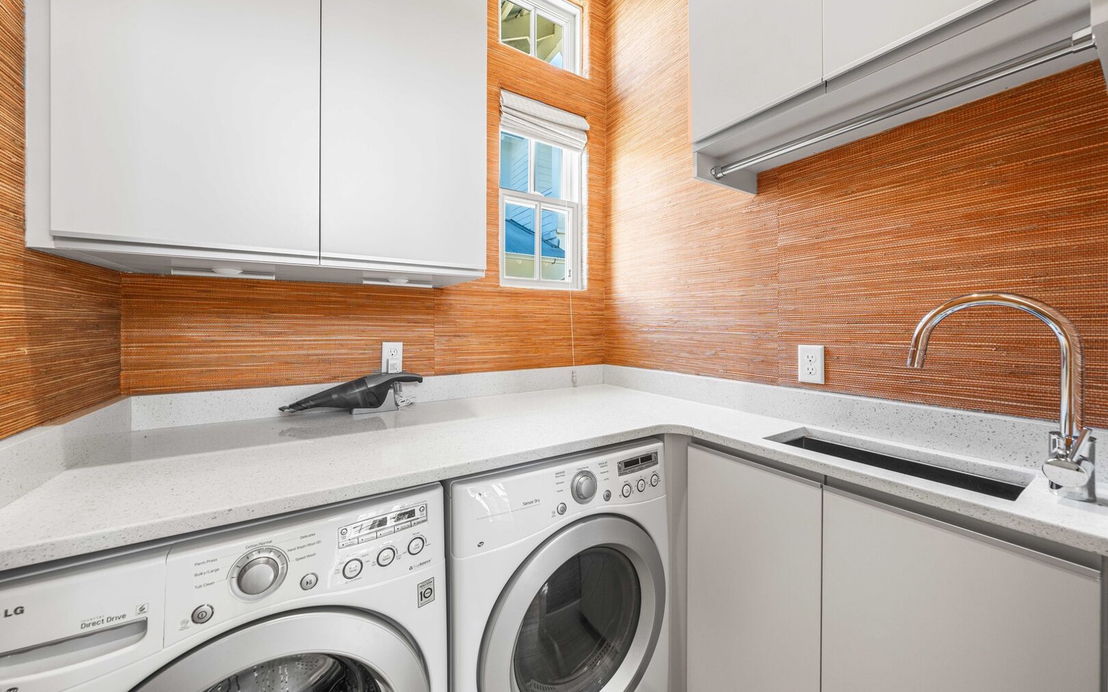 Your dedicated laundry space features modern appliances and elegant stone countertops, making laundry day effortless during your stay.