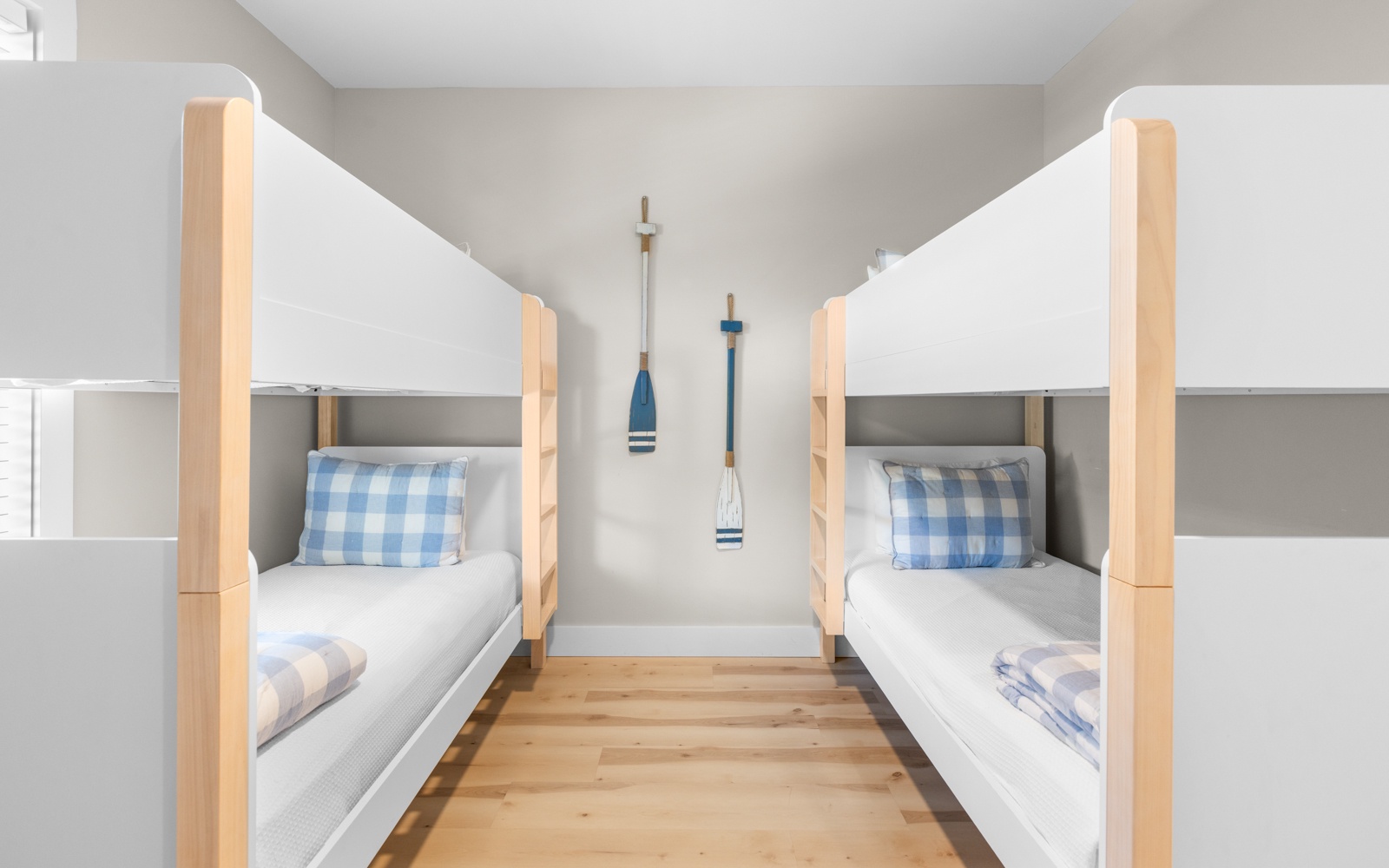 Your cozy bunk room features nautical-themed bedding and charming wall decor, perfect for families or friends sharing memories together.