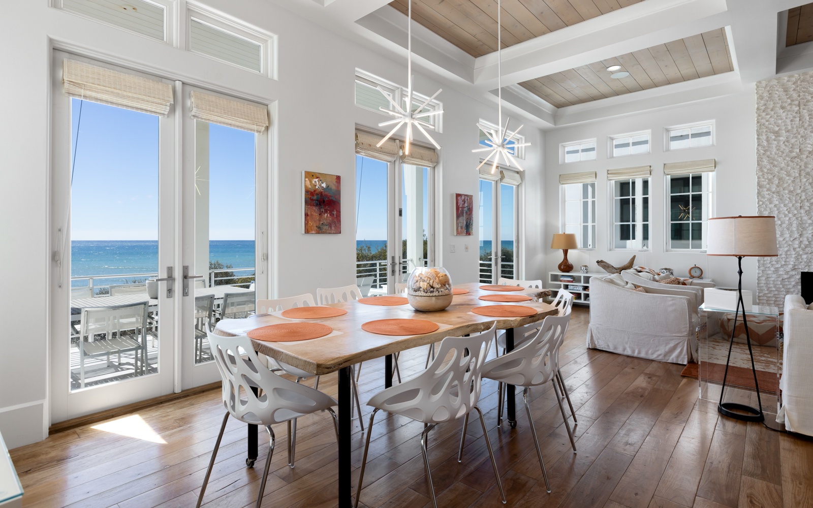 Your dream dining room awaits with gulf views stretching beyond floor-to-ceiling windows, where every meal becomes a coastal celebration.