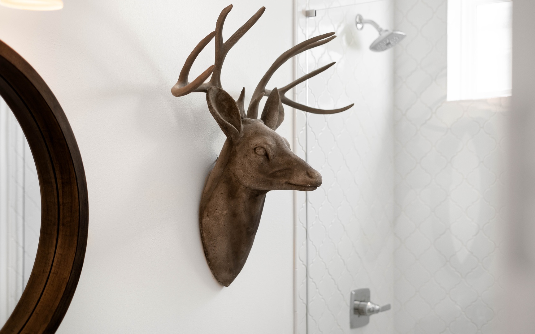 Your bathroom features charming rustic touches with stylish decorative elements that create a cozy, cabin-like atmosphere during your stay.