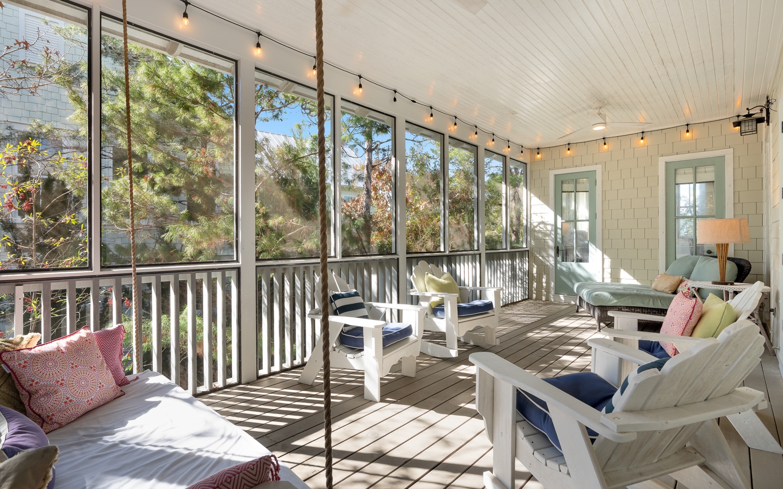 Your screened porch offers the perfect retreat with cozy seating, twinkling lights, and peaceful garden views for relaxing mornings and evenings.