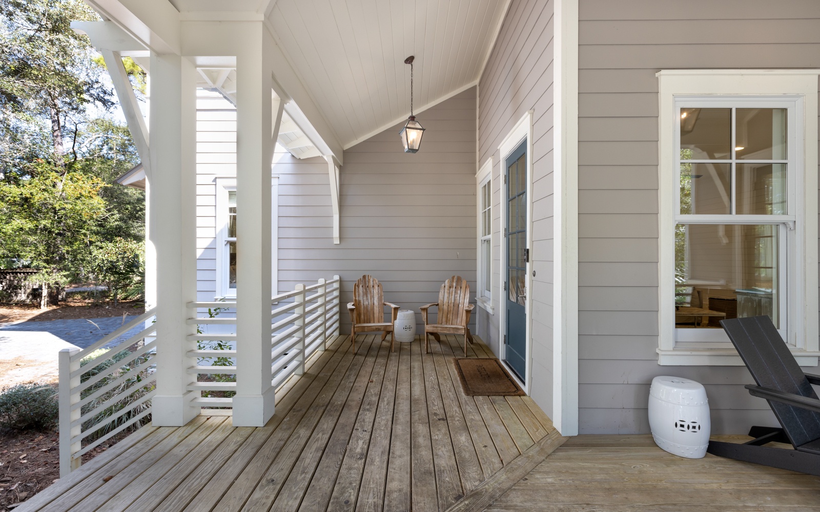 Relax on your private covered porch with Adirondack chairs, perfect for morning coffee or evening conversations.