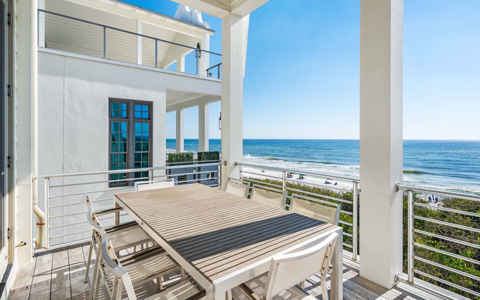 Your private oceanfront balcony offers unobstructed sea views, perfect for morning coffee or sunset dining with waves as your soundtrack.