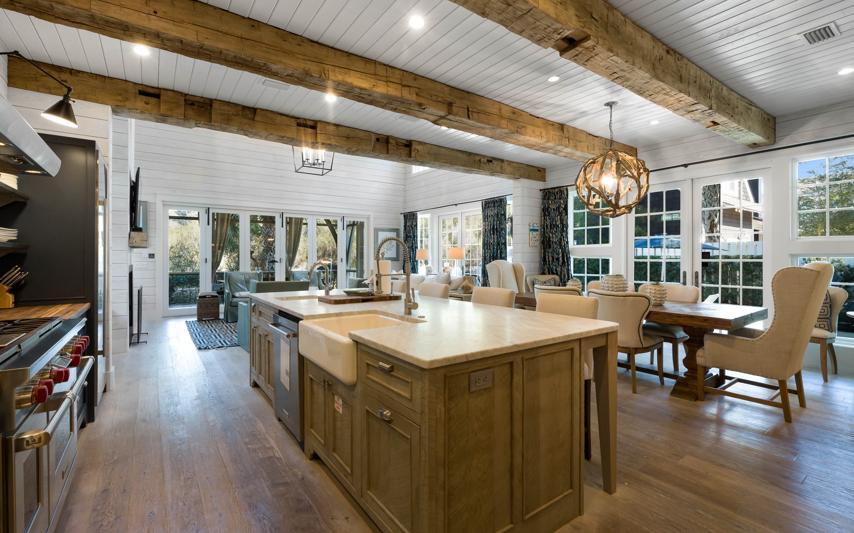Your dream kitchen awaits with rustic wood beams, gleaming countertops, and a cozy dining nook bathed in natural light.