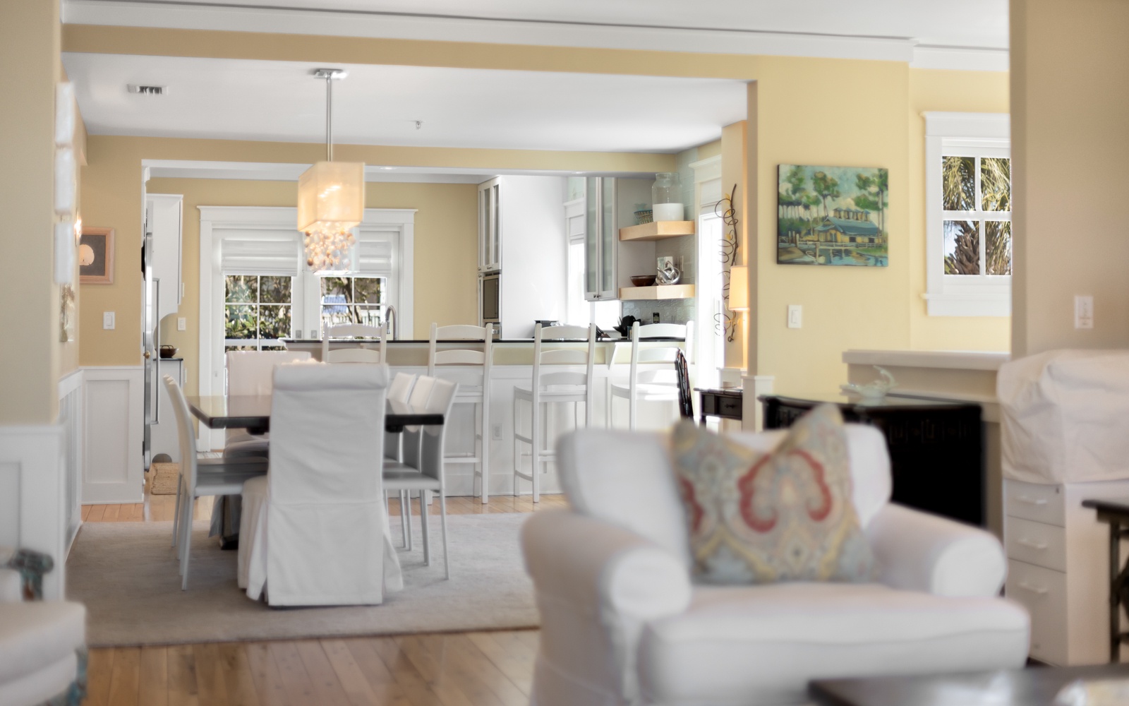 Your open-concept living flows seamlessly into a bright kitchen, where morning coffee tastes better at the elegant island.