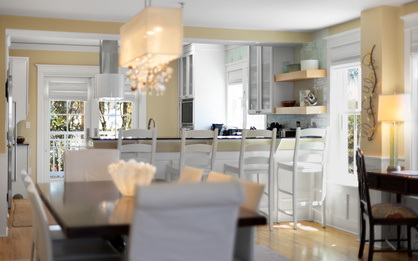 Step into your elegant open-plan kitchen where you'll love preparing meals at the spacious island while natural light streams through beautiful windows.