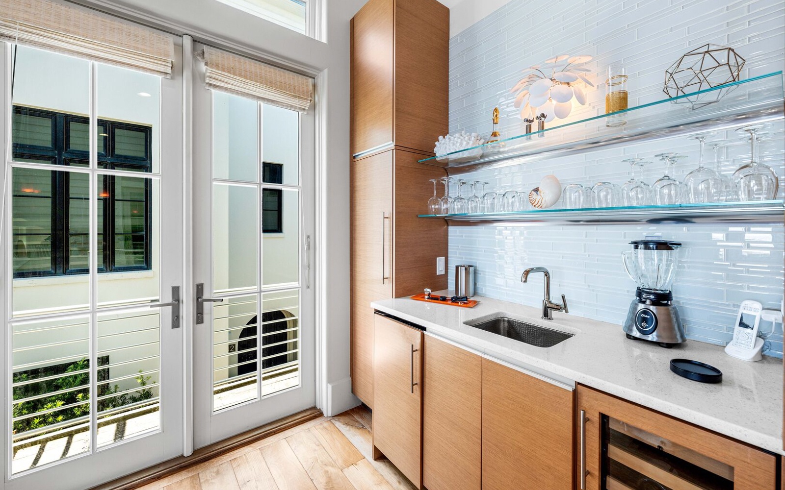 Your sleek kitchen features modern appliances and opens to a private balcony with city views.