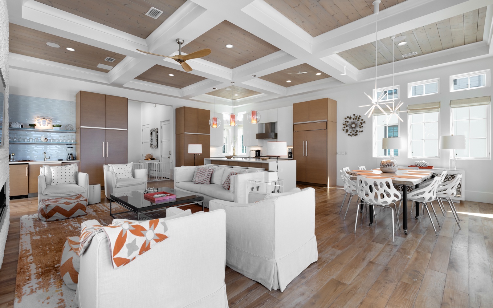 Gather in this stunning open-concept space where your group can cook, dine, and relax together under soaring coffered ceilings.